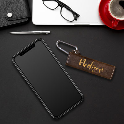 power bank on top of black table next to smartphone